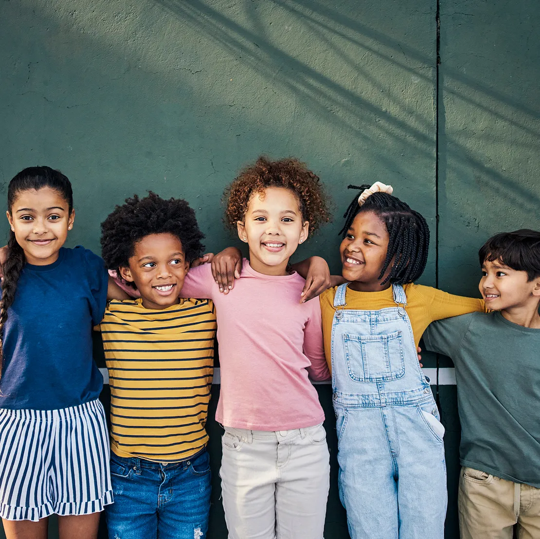 Group of young kids hugging